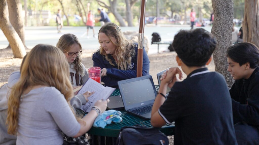 Teacher with students outside